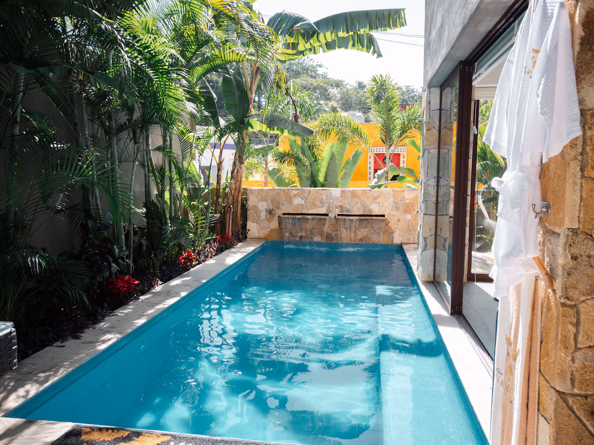 Private lap pool with waterfall and tropical garden at Villa Vargas Sayulita