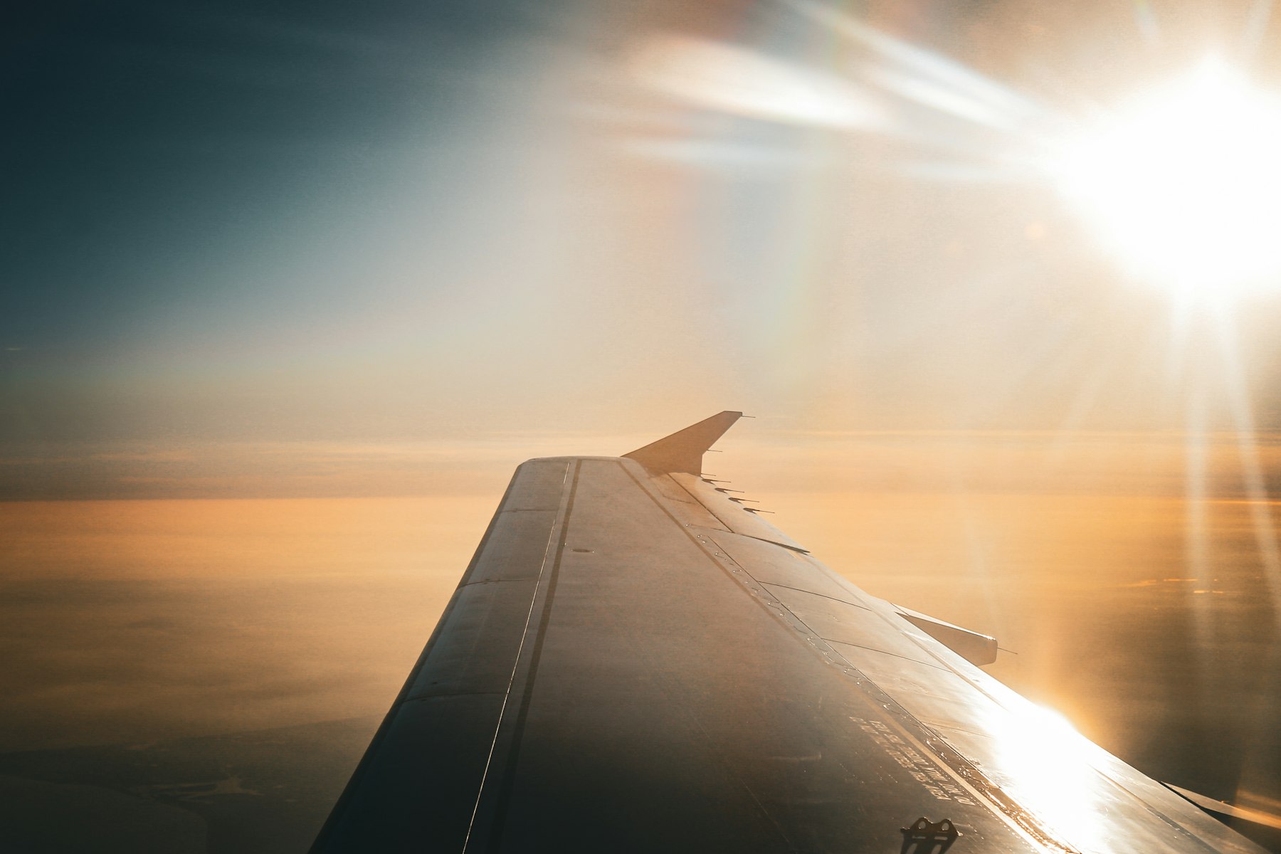 An aircraft wing above the clouds on the flight to Puerto Vallarta