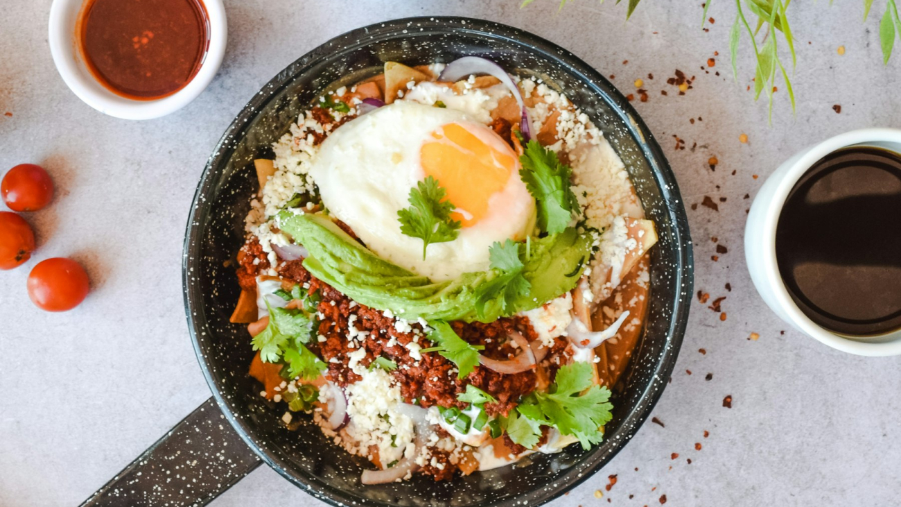 Mexican breakfast of chilaquiles with two cups of coffee, like the best breakfast in Sayulita