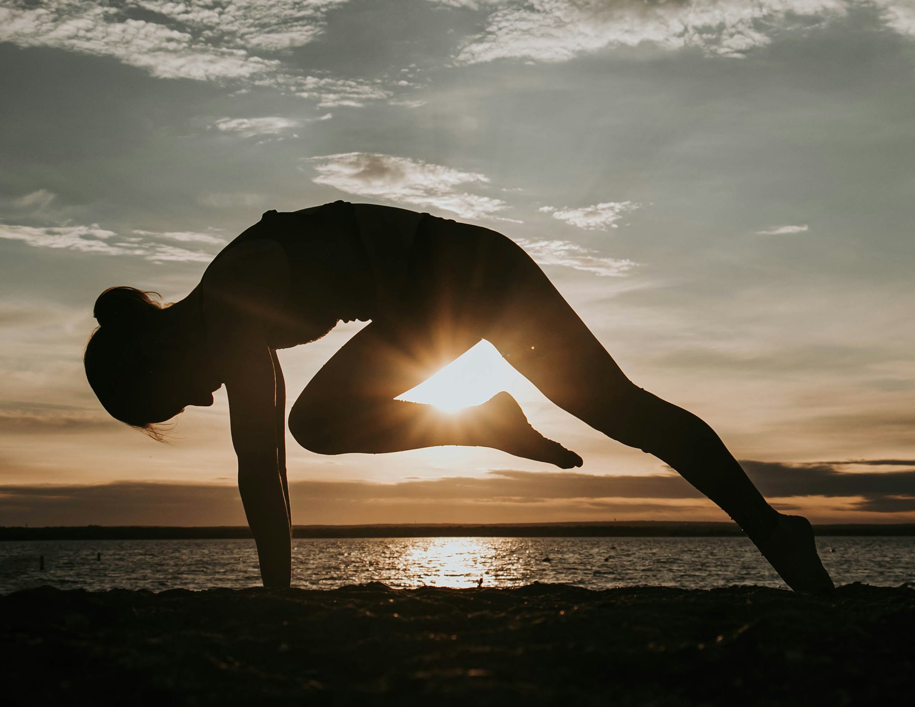 A yoga pose held against the sunset in Sayulita