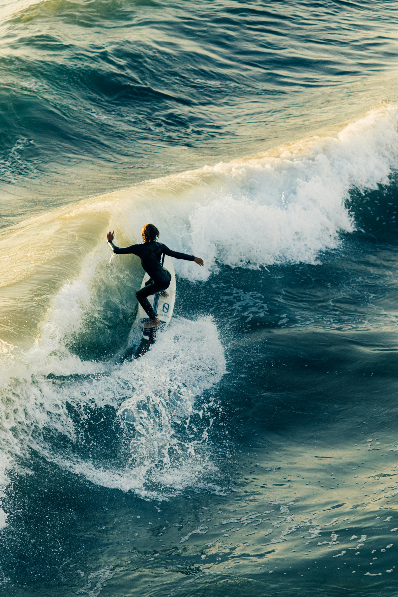 A surfer riding a wave off Sayulita
